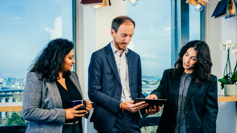 Employees Looking at Tablet