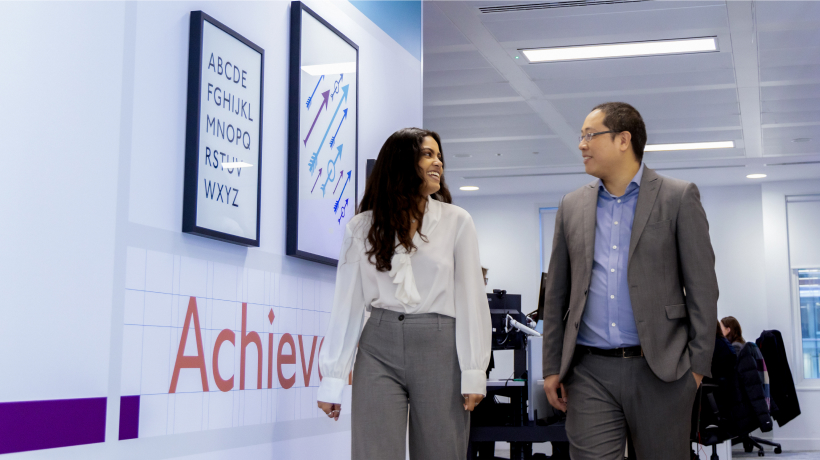 Employees Walking Together in Office