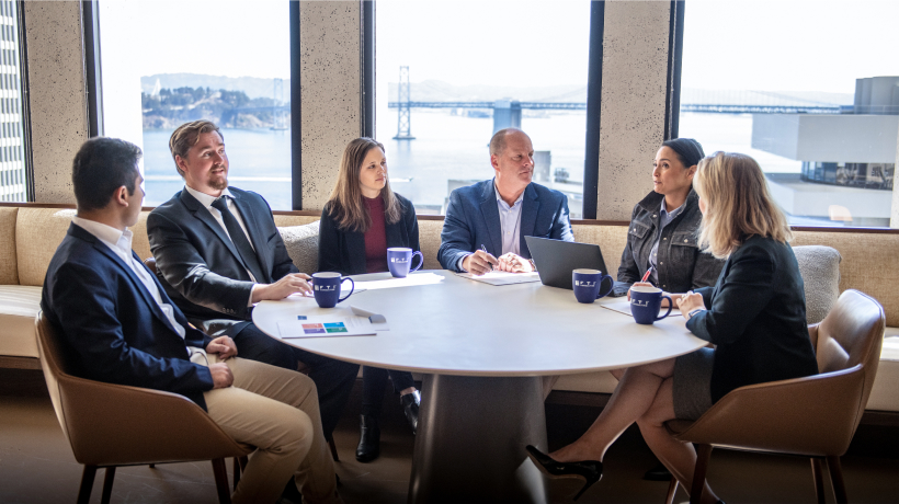 Employees Meeting at Lounge Table