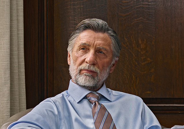 Business professional sitting in a chair and thinking