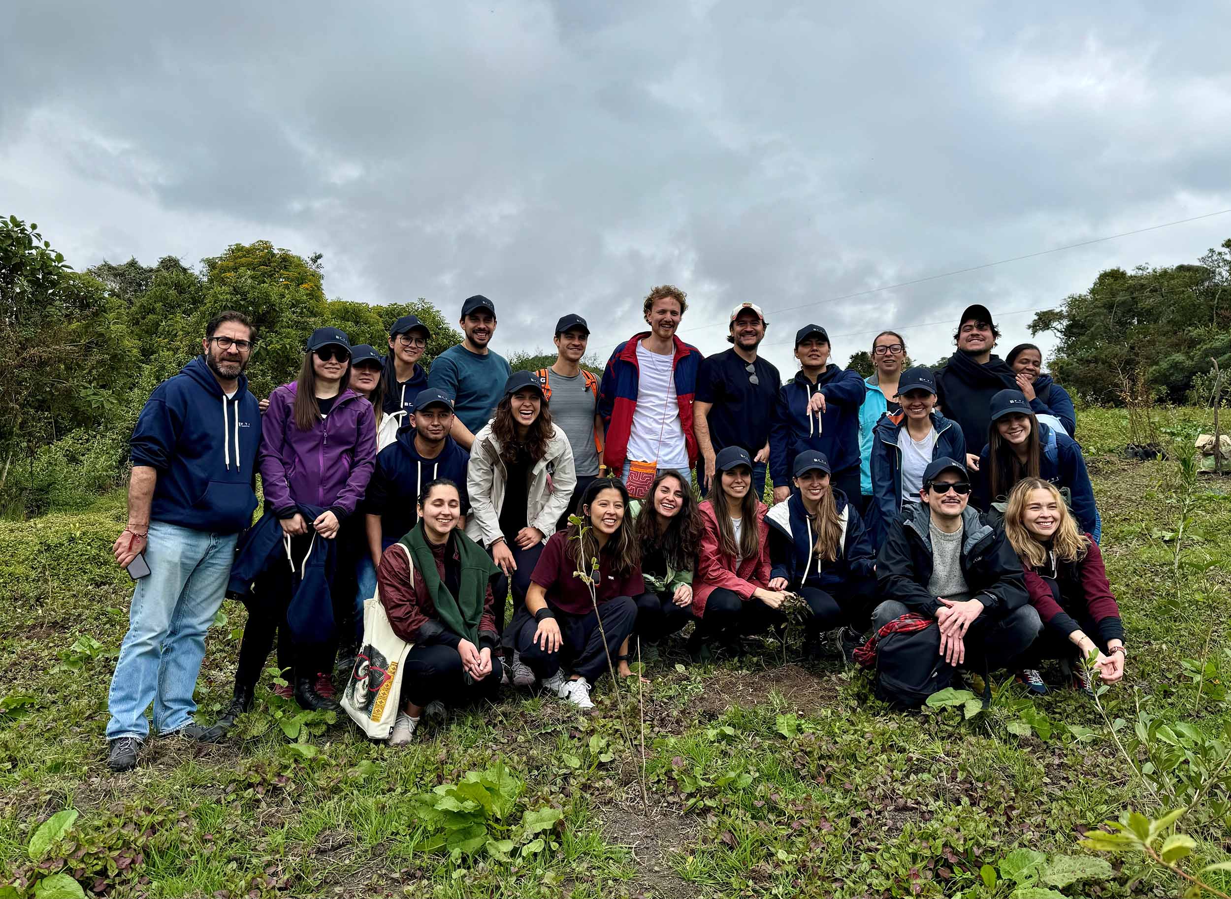 a group of people smiling and posing for a picture 