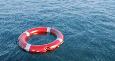 Red and White Life Saver Floaty In the Ocean